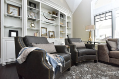 leather lounge chairs in grand living room  comfortable luxury interior design